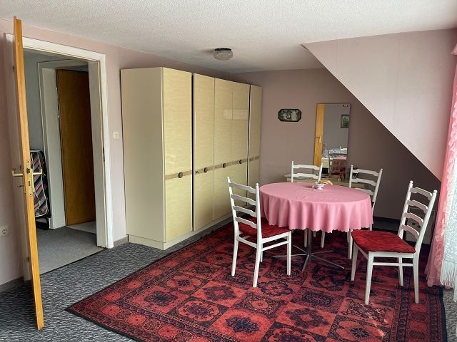 Schlafzimmer mit Sitzecke
